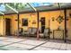 Outdoor patio with covered seating and neutral decor at 4101 N Forbes Rd, Plant City, FL 33565