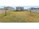 Huge backyard area with perimeter fencing and immature trees planted at 8009 Sail Clover Ln, Zephyrhills, FL 33540