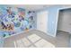 Quirky bedroom with ample natural light and an eye-catching feature wall at 8009 Sail Clover Ln, Zephyrhills, FL 33540