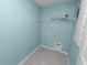 Dedicated laundry room offering tile flooring and washer and dryer hookups at 8009 Sail Clover Ln, Zephyrhills, FL 33540