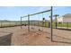 Community playground with swings and a scenic backdrop of a lake and residential area at 8009 Sail Clover Ln, Zephyrhills, FL 33540