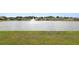 A view of the community's picturesque pond and fountain, surrounded by lush greenery at 8009 Sail Clover Ln, Zephyrhills, FL 33540