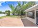 A nice back yard with a deck and mature trees, providing a private and relaxing outdoor space at 1411 Fernwood Pl, Seffner, FL 33584