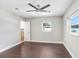 Cozy bedroom with ceiling fan, natural light, and neutral paint. Perfect for relaxation and rest at 1411 Fernwood Pl, Seffner, FL 33584