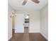 Bedroom with wood floors, a ceiling fan, and a sliding closet door at 1411 Fernwood Pl, Seffner, FL 33584