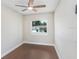 Bedroom with light walls, wood flooring, and a bright window at 1411 Fernwood Pl, Seffner, FL 33584