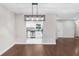 Open dining area with stylish lighting and modern finishes flows into the updated kitchen at 1411 Fernwood Pl, Seffner, FL 33584