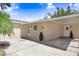 Well-maintained, single-story home with an extended carport and brick facade at 1411 Fernwood Pl, Seffner, FL 33584
