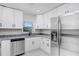 Updated kitchen boasts stainless steel appliances, bright white cabinets and granite countertops at 1411 Fernwood Pl, Seffner, FL 33584