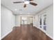Open-concept living room offers wood floors and bright lighting at 1411 Fernwood Pl, Seffner, FL 33584