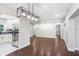 Open-concept living space features hardwood floors, stainless steel appliances, and ample natural light at 1411 Fernwood Pl, Seffner, FL 33584