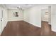 Open-concept living room boasts wood floors and ample natural light at 1411 Fernwood Pl, Seffner, FL 33584