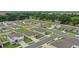 Aerial view of a residential neighborhood featuring tidy lawns, uniform housing, and quiet streets at 203 Lovely Ct, Plant City, FL 33566