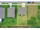 An aerial view displays the layout of the neighborhood, highlighting rooflines, greenery, and streetscapes at 203 Lovely Ct, Plant City, FL 33566