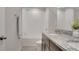 Bright bathroom featuring a dual sink vanity with granite countertops and a tiled shower and tub combination at 203 Lovely Ct, Plant City, FL 33566