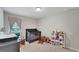 Cozy Bedroom featuring a crib, changing table, rocking chair, and organized storage for a peaceful space at 203 Lovely Ct, Plant City, FL 33566