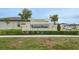 Stone Lantana Grove community sign with hedges, landscaping and stone work at 203 Lovely Ct, Plant City, FL 33566