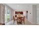 Bright dining area featuring a round table and slider doors that bring in natural light and outdoor views at 203 Lovely Ct, Plant City, FL 33566