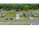 A charming two-story home is displayed, featuring a well-maintained lawn, landscaping, and inviting curb appeal at 203 Lovely Ct, Plant City, FL 33566