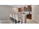 Eat-in kitchen with dark wood cabinets, granite countertops, and seating for four at the breakfast bar at 203 Lovely Ct, Plant City, FL 33566
