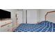Relaxing bedroom with a plush bed, dresser with a TV, and closet, offering a comfortable private space at 203 Lovely Ct, Plant City, FL 33566