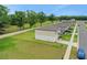 Neighborhood street with manicured lawns and newly constructed homes along a sidewalk, showcasing modern suburban living at 203 Lovely Ct, Plant City, FL 33566