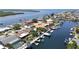 Aerial view of residential neighborhood featuring waterfront homes and boating canals at 4921 Marlin Dr, New Port Richey, FL 34652