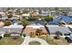 Waterfront home with canal access, lush landscaping, and circular driveway at 4921 Marlin Dr, New Port Richey, FL 34652
