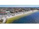 Aerial view of waterfront homes near a beach and the ocean at 4921 Marlin Dr, New Port Richey, FL 34652