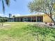 Backyard featuring a screened in lanai and waterfront views at 4921 Marlin Dr, New Port Richey, FL 34652