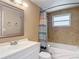 Bathroom with a white vanity and a shower/tub combo with tile surround at 4921 Marlin Dr, New Port Richey, FL 34652
