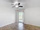 Bedroom featuring a ceiling fan and glass doors leading to the outside at 4921 Marlin Dr, New Port Richey, FL 34652