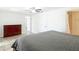 The main bedroom features tiled floors, neutral walls, ceiling fan, and ensuite bathroom at 4921 Marlin Dr, New Port Richey, FL 34652