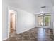 Bright, spacious bedroom with modern flooring, ceiling fan, and window at 4921 Marlin Dr, New Port Richey, FL 34652