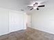 Bedroom with ceiling fan and view into hallway at 4921 Marlin Dr, New Port Richey, FL 34652