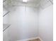 This walk-in closet provides plenty of storage space with metal shelving at 4921 Marlin Dr, New Port Richey, FL 34652