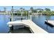 Private boat dock with boat lift providing direct access to waterways at 4921 Marlin Dr, New Port Richey, FL 34652