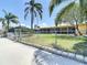 Backyard with partial fence and lanai views at 4921 Marlin Dr, New Port Richey, FL 34652