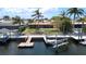 Aerial view of home with boat dock and backyard overlooking the water at 4921 Marlin Dr, New Port Richey, FL 34652
