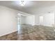 Bright and open living space with modern flooring and access to multiple rooms at 4921 Marlin Dr, New Port Richey, FL 34652