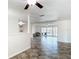 Spacious living area with tile flooring, open layout, and sliding glass doors at 4921 Marlin Dr, New Port Richey, FL 34652