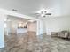 Open-concept living area with ceramic tile floors seamlessly connects to the kitchen and other living spaces at 4921 Marlin Dr, New Port Richey, FL 34652