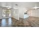 Open concept living area with tile flooring, ample natural light, and kitchen view at 4921 Marlin Dr, New Port Richey, FL 34652