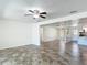 Open living area with ceramic tile floors and easy access to the kitchen and other areas of the home at 4921 Marlin Dr, New Port Richey, FL 34652