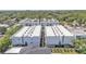 Aerial view showcasing building's roof with surrounding trees and rooftops at 5008 S Macdill Ave # 12, Tampa, FL 33611