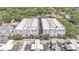 Aerial view showcasing building's roof with surrounding palm trees and rooftops at 5008 S Macdill Ave # 12, Tampa, FL 33611
