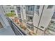 Balcony overlooking manicured landscaping with modern exterior of building, creates inviting outdoor oasis at 5008 S Macdill Ave # 12, Tampa, FL 33611