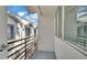 Private balcony with metal railing, offering a serene outdoor space and views of neighboring architecture at 5008 S Macdill Ave # 12, Tampa, FL 33611
