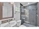 Stylish bathroom with a glass-enclosed shower, contemporary fixtures, and mosaic tile accents at 5008 S Macdill Ave # 12, Tampa, FL 33611