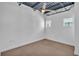 Cozy bedroom featuring neutral carpet, white walls, and bright windows, for restful nights at 5008 S Macdill Ave # 12, Tampa, FL 33611